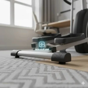 Macro shot of the non-slip rubberised feet of an under-desk elliptical ensuring stability on a typical grey British office carpet and laminate flooring.