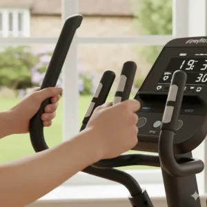 Hand-grip pulse sensors on the handlebars of an elliptical for tracking heart rate during a cardio session.