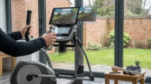 A compact Bluetooth elliptical compatible with Zwift positioned in a modern British spare room gym setup.