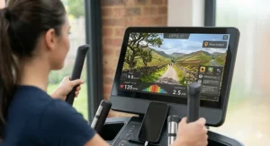 Alt text for image 3: A photorealistic view of a cross trainer screen displaying a virtual training programme through a scenic Peak District landscape.