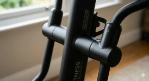 Close-up of a reinforced steel frame on a cross trainer, highlighting the build quality covered by a lifetime guarantee.