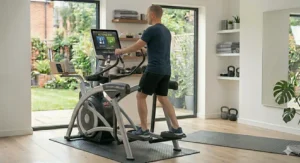 Diagram showing the simple assembly process for the 2 in 1 elliptical bike combination, including the standard UK 3-pin power adapter.