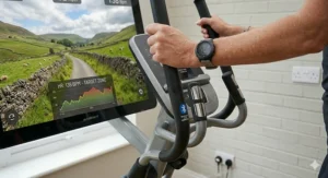 Alt text for image 7: A pair of hands holding the pulse sensors on a cross trainer handle, with a Bluetooth icon indicating a connection to a fitness watch and virtual route software.