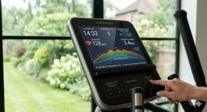 The digital display of an orthopedic cross trainer showing heart rate tracking and low-impact workout programmes.