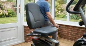 Close-up of a high-back ergonomic seat with lumbar support on a recumbent elliptical for maximum user comfort.