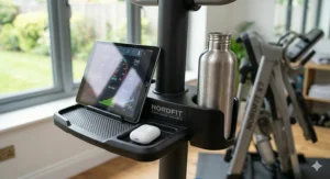 Convenience features of the adjustable incline cross trainer, including a tablet mount and bottle holder.