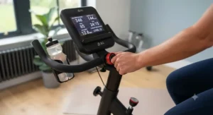 A close-up of a digital exercise bike console displaying varied intensity settings for a calorie-burning workout.