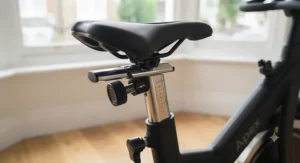 Detailed view of the fully adjustable saddle and handlebars on a premium spin bike for optimal cycling posture.