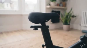 A detailed look at the adjustable seat post of a home exercise bike, allowing for a custom, comfortable riding position.