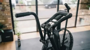 Athlete using dual-action handles on an air bike for a full-body workout