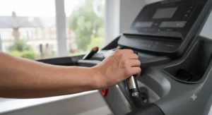 Close-up of hand pulse sensors integrated into the treadmill handle bars.