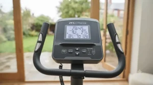 Digital console display on a recumbent bike showing cycling metrics.