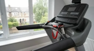 Detailed view of essential treadmill safety clips and side support rails.