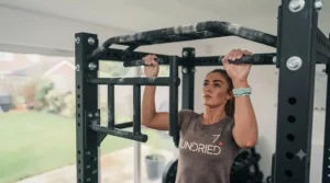 Multi-grip pull-up bar attached to a heavy-duty power rack frame